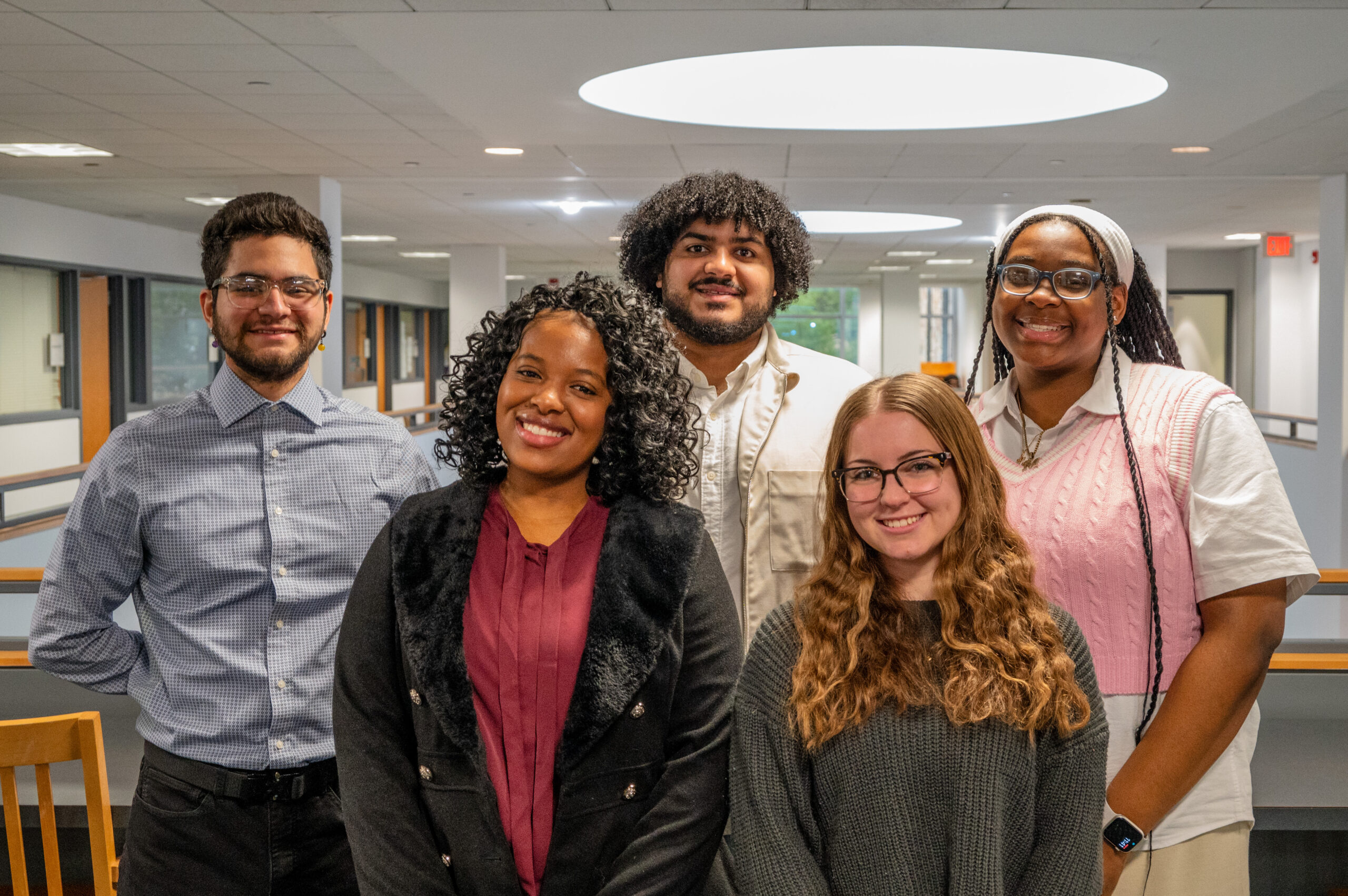 group of diverse students smiling at camera