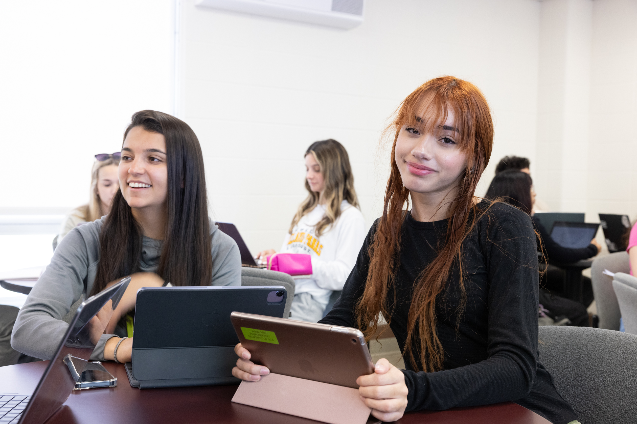 students smiling at camera