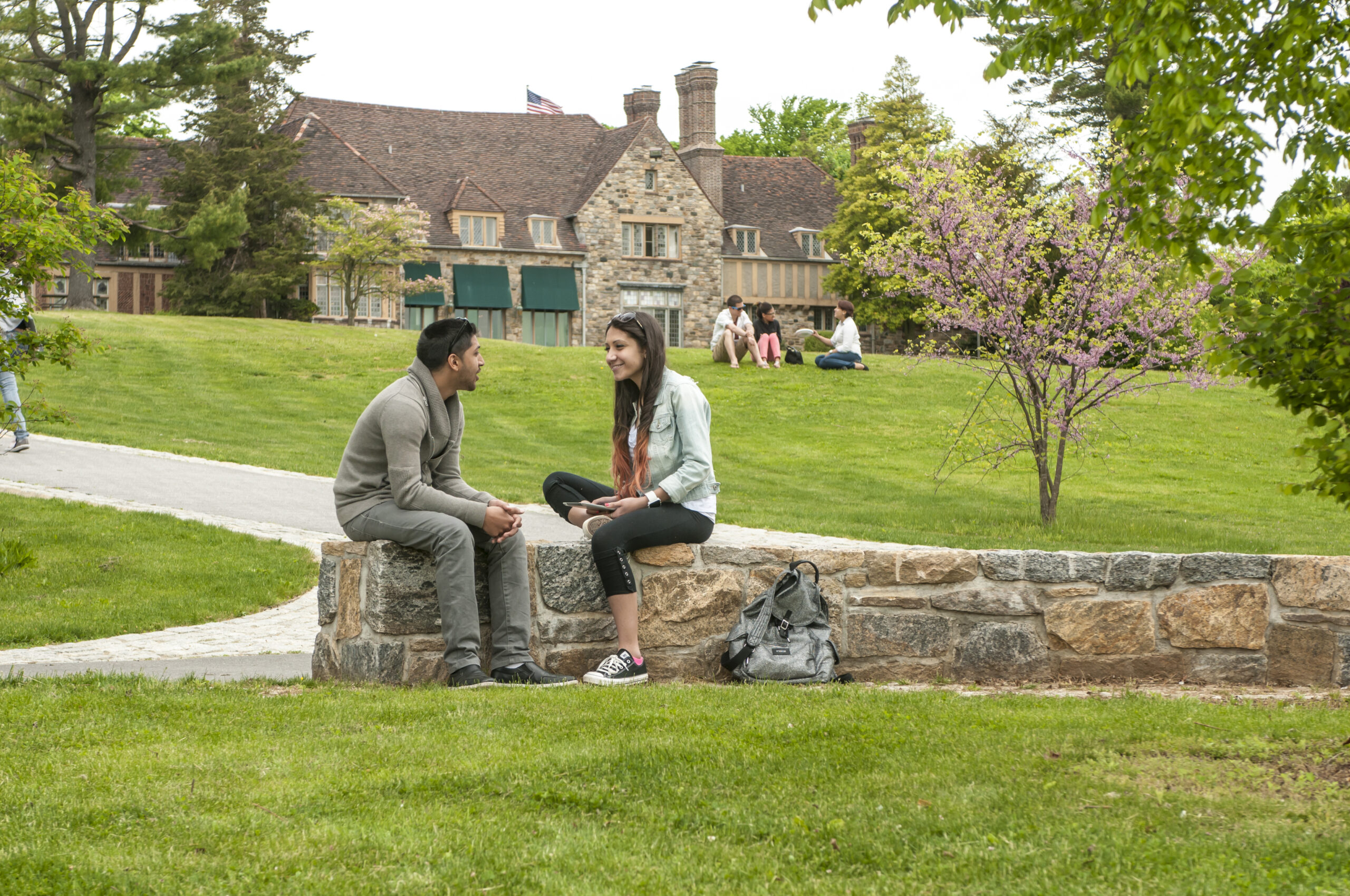 Two students talking on campus outside