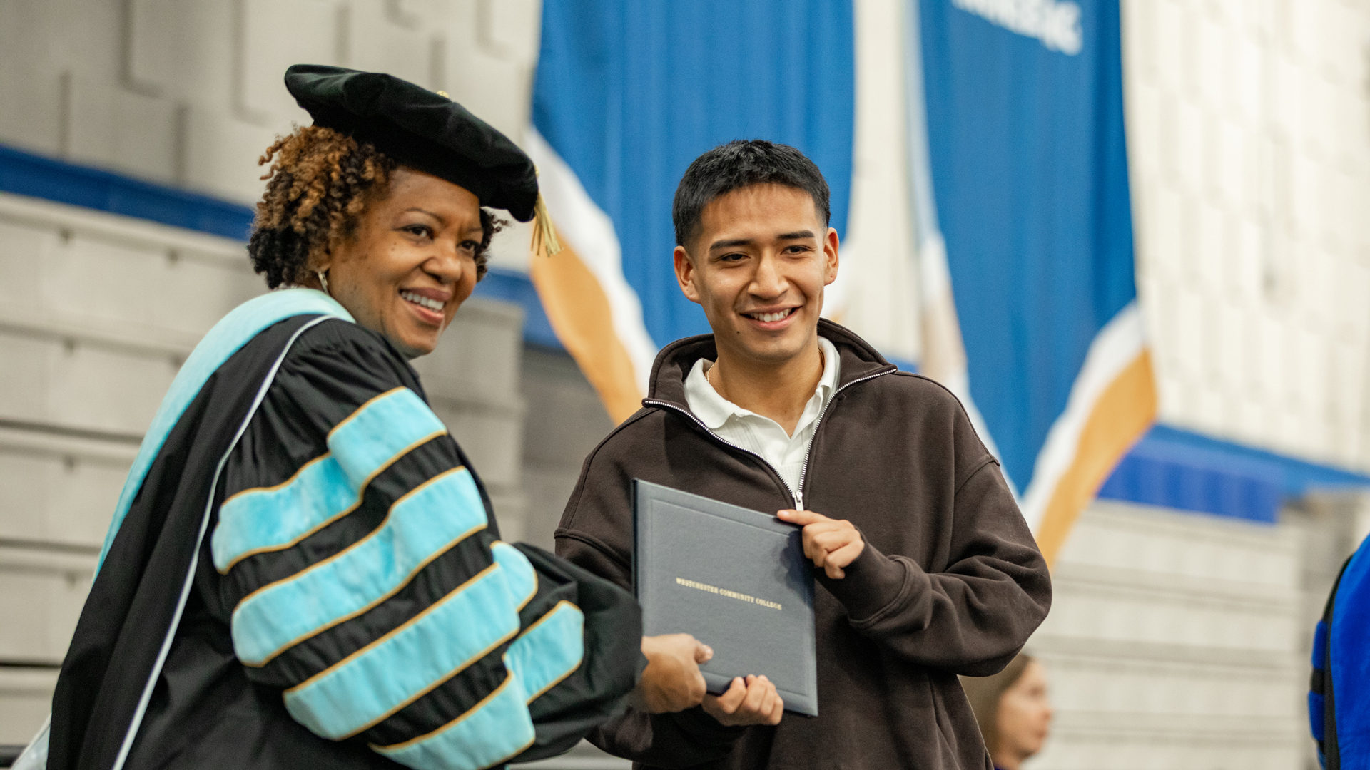 Graduate at Commencement with President Miles