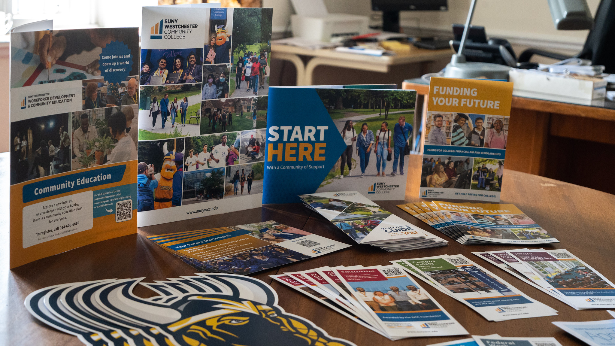 Publication samples on a table, viewed head-on